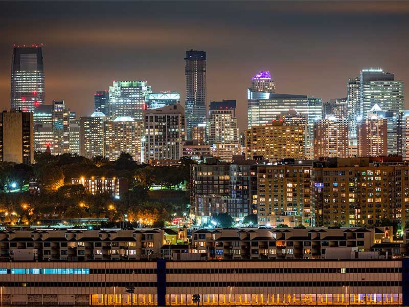 Jersey City skyline rises behind Hoboken and Weehawken cities