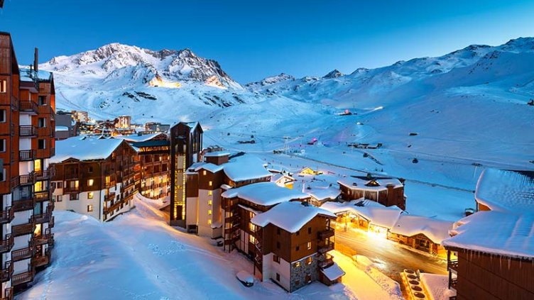 Panorama of snowy mountains and hotels in a French Alps ski resort