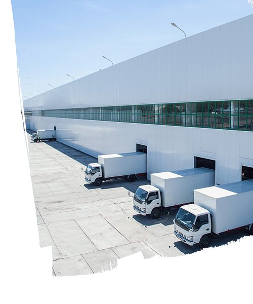 View of logistics warehouse building with trucks